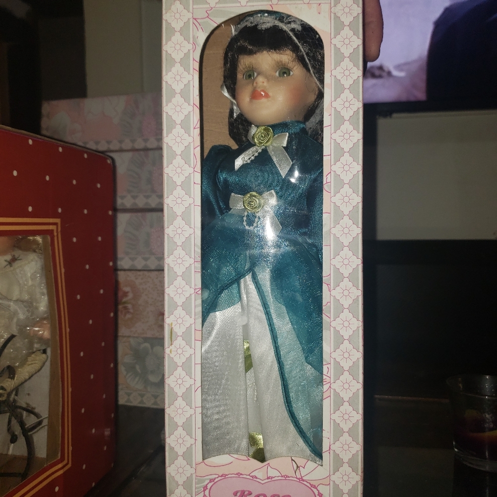 Antique porcelain dolls,never opened . Make offer
